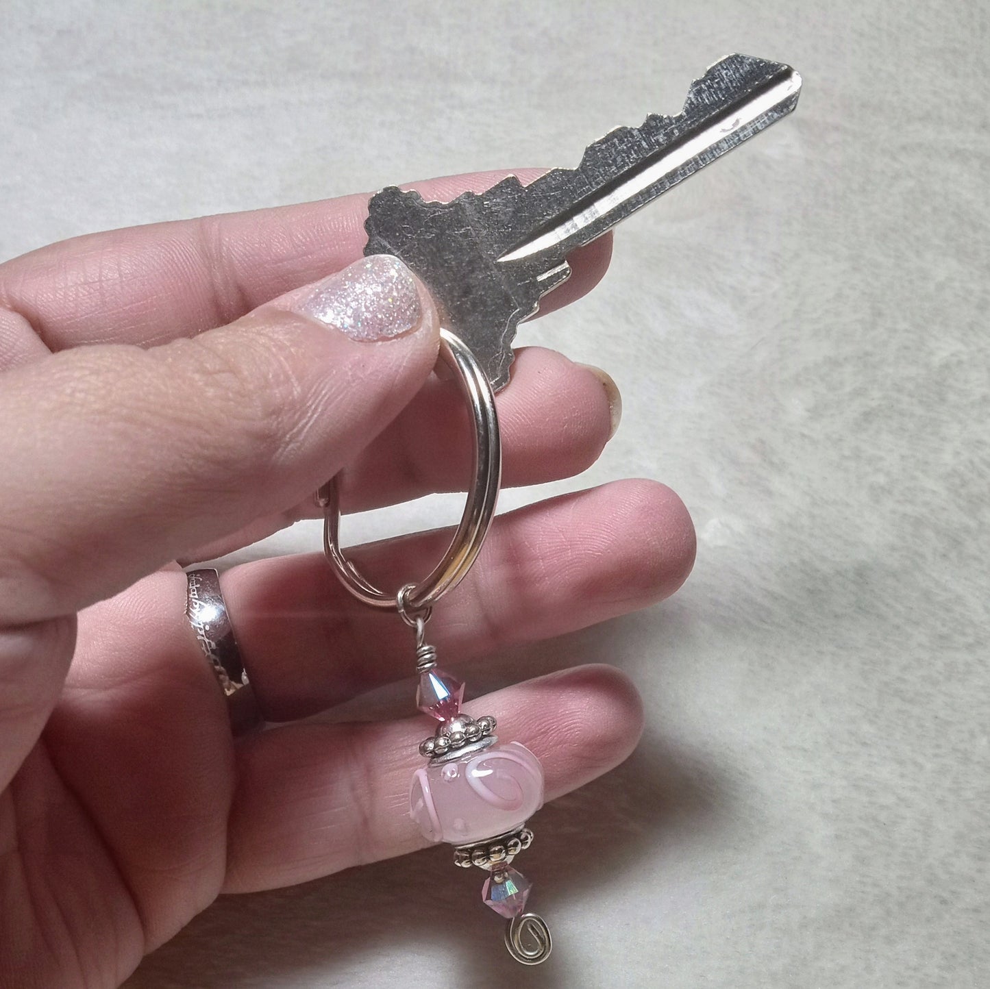 Wonderlust assorted black keychains