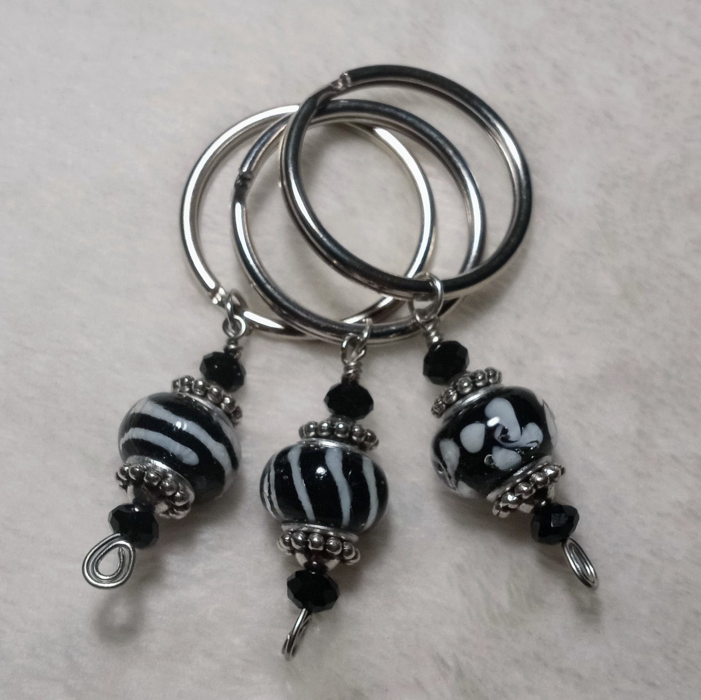 Wonderlust assorted black keychains