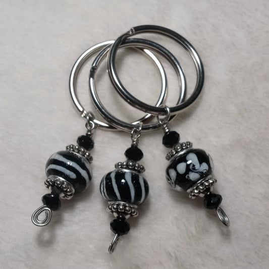 Wonderlust assorted black keychains