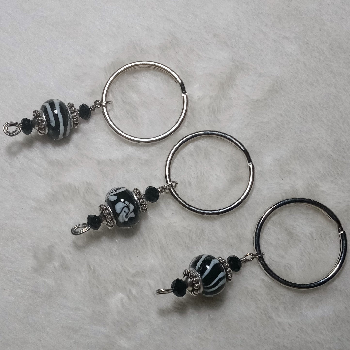 Wonderlust assorted black keychains