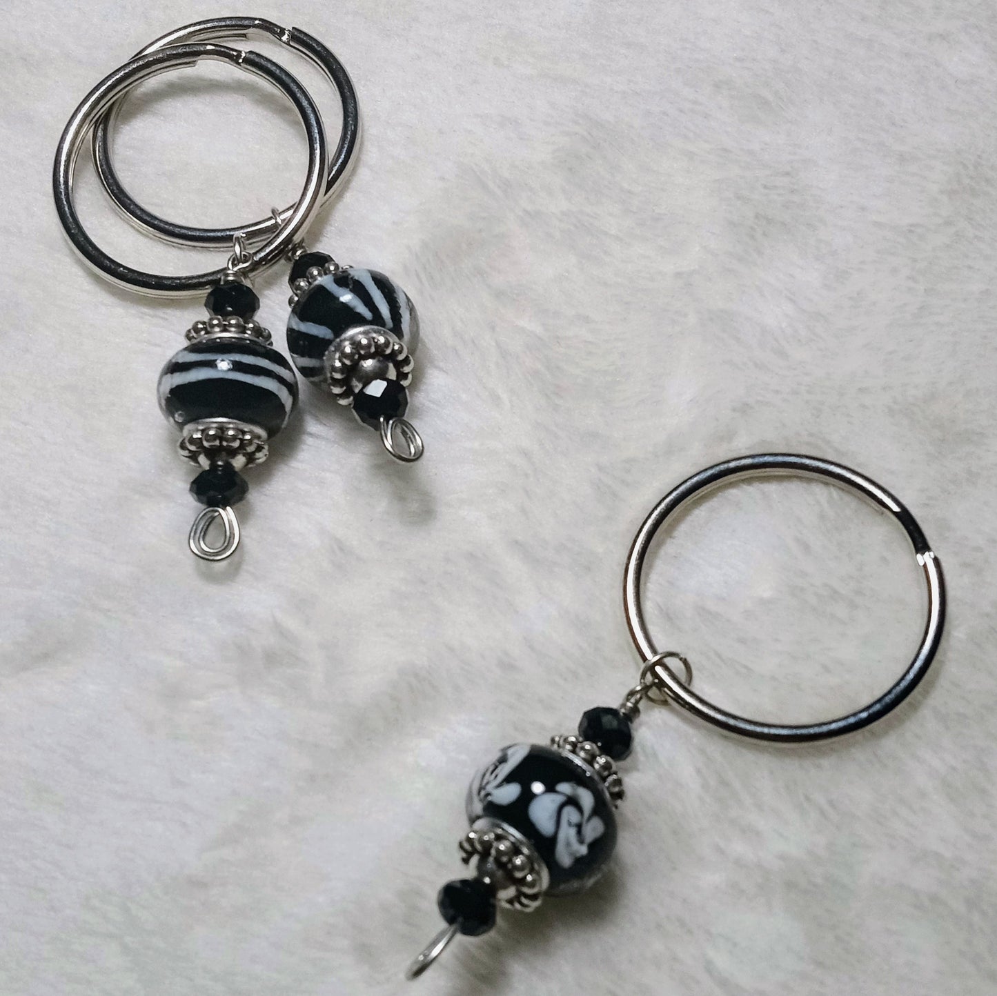 Wonderlust assorted black keychains